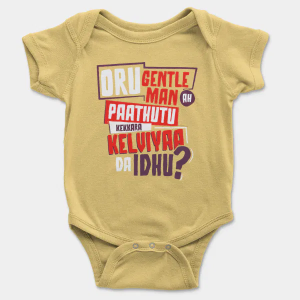Oru Gentleman Ah Paathuthu Kekkara Kelviyaa Da Idhu Short Sleeve Baby Onesie in Butter Color